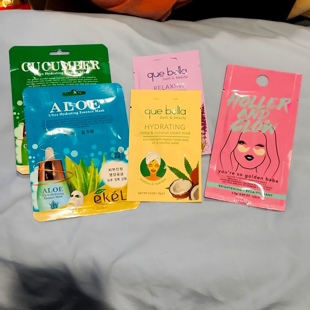 Group of 4 face masks and one under eye mask,  all new, never opened